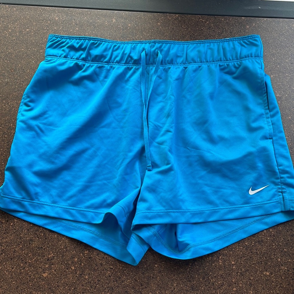 Brand new blue Nike athletic shorts.